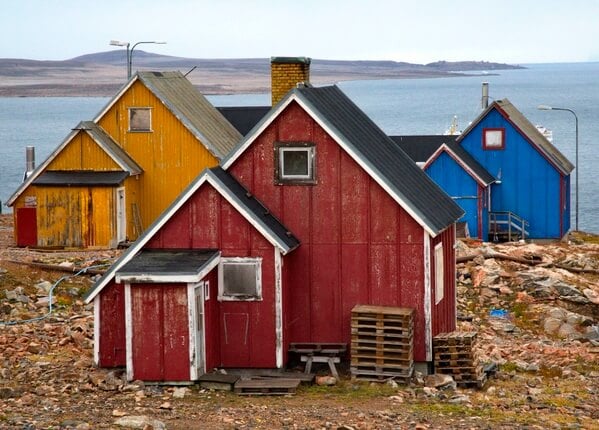 A view of the similar roof lines and construction of the houses.  The colors look bright from far away but up close they are quite worn due to conditions.
