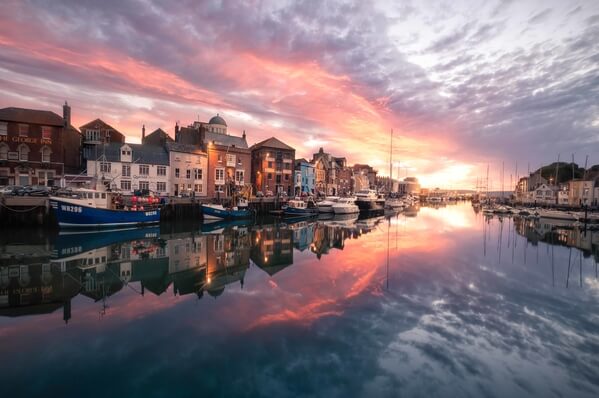 Weymouth Harbour often offers mirror like reflections which, when coupled with dramatic skies, can produce stunning imagery.