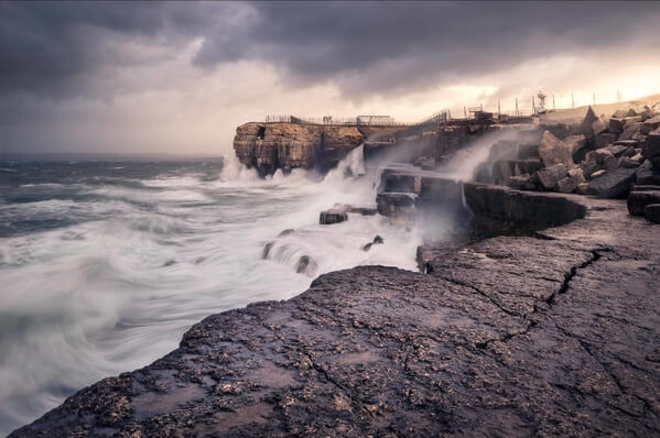 Taken from the shelter of Pulpit Rock, heading West along the rugged coastline, as winters storms crash in.  Whilst this location can offer great opportunity, extreme care must be taken and should not be attempted during larger storms where waves are breaking around and onto this ledge.