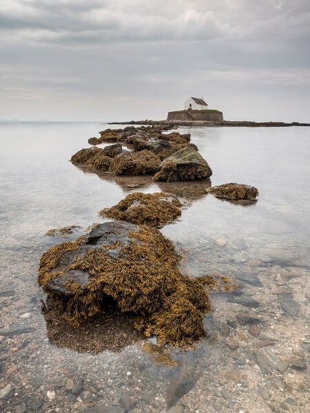 Long exposure with the rocks exposed by the low tide