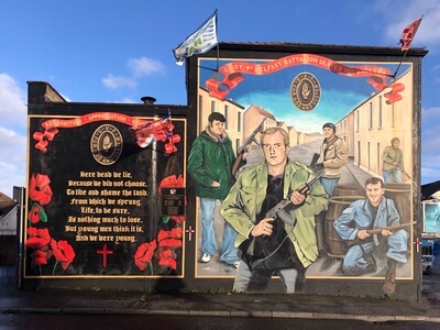 We Were Young mural 5 - A. E. Housman’s 1919 short poem “Here dead we lie” is featured, together with the poppies that grew on the Western Front in WWI, in this UVF commemorative mural. 
