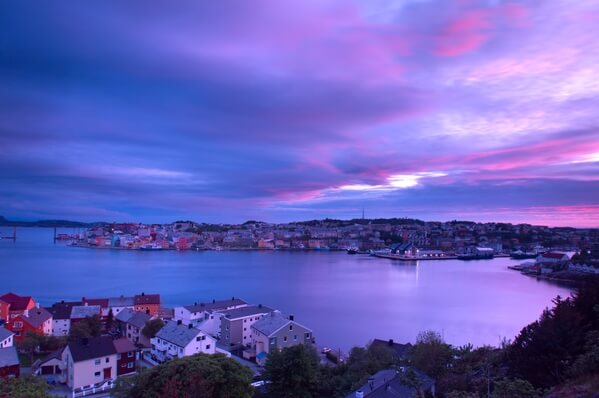 Kristiansund at sunset midsummer. During Spring and Fall, the sun will set in the middle of the frame, and during winter the sun will set on the far opposite side. 