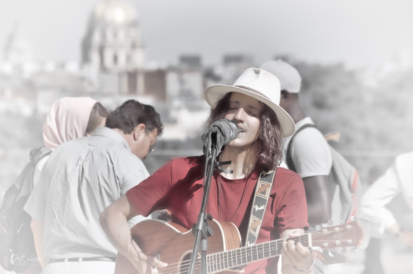 Busking with Sacré-Coeur in the background