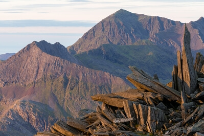 A telephoto shot of part of the castle with Crib Goch and Snowdon in the distance. 