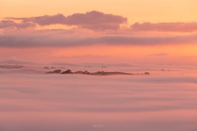 Layers of fog in the valley at sunrise