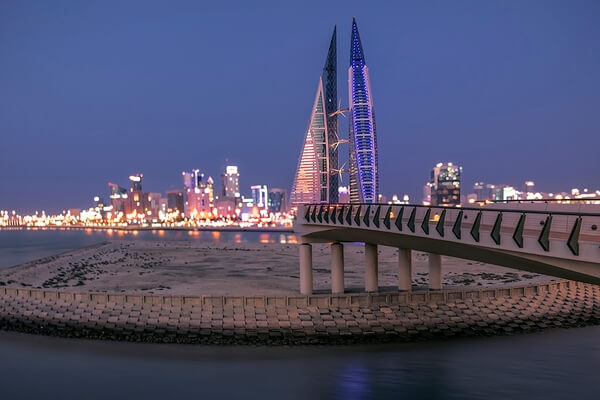 CITY LIGHTS OF MANAMA CITY AT BLUE HOUR TIME .