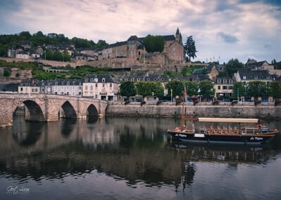 Dordogne instagram locations - River bank view at the old bridge of Terrasson-Lavilledieu