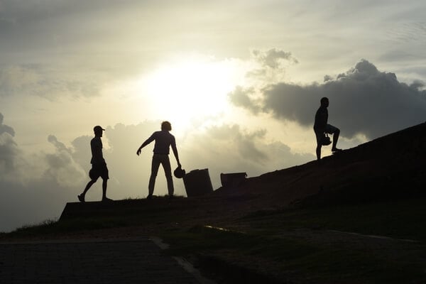 Silhouettes in Galle Fort after dusk 