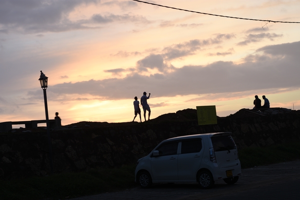 Silhouettes in Galle Fort after dusk 