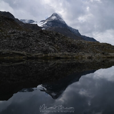 Pizzo Scalino reflecting in one of the Campagneda lakes
