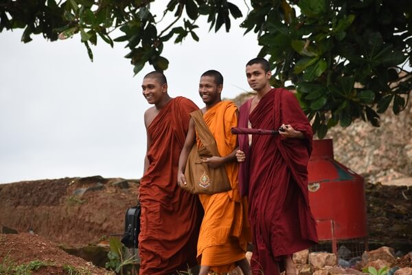 A group of young Buddhist priests enjoying the evening breeze in Galle Fort
