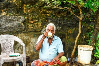 An old man with a cup of tea to make the day 