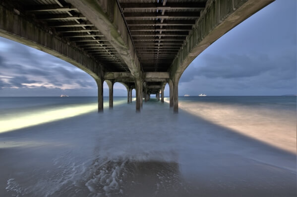 Early morning shot from underneath the pier on a long exposure 