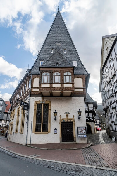 Hoher Weg - behind the market place. The building is adorned with intricate wood carvings including the famous saucy dairymaid who scratches her bare bottom whilst churning the milk.
