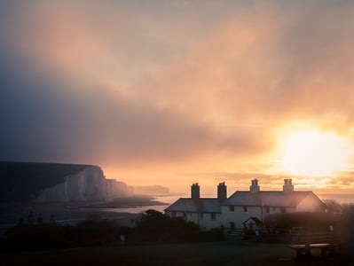 Golden winter sunrise over the coastguard cottages. The seven sisters featuring in the background.