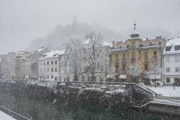 Winter views to Ljubljana Castle and Ljubljanica river