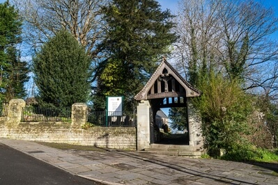 Car parking either side of the Lych Gate (small, free car parks).