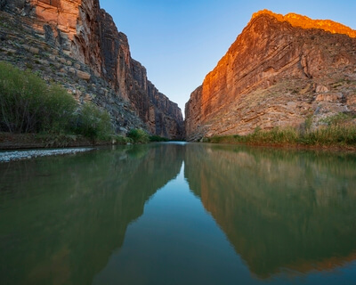 Santa Elena Canyon of the Rio Grande River just as first light starts to hit the top of the canyon walls