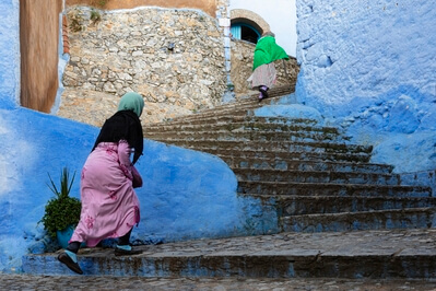 Women Walking up Steps in the Medina of Chefchaouen