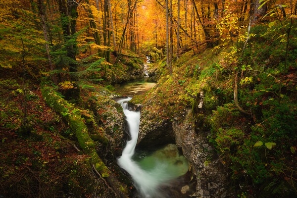 A small waterfall of the Mostnica river in autumn