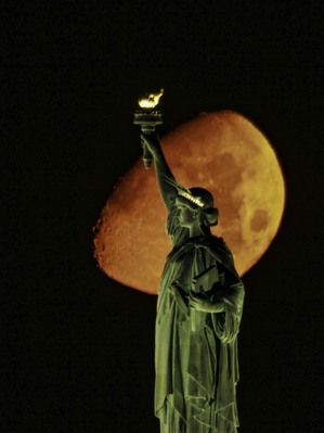 Moonset at Statue of Liberty.