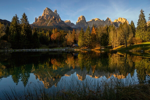 Autumn view of the Pale di San Martino from Lake Welsperg