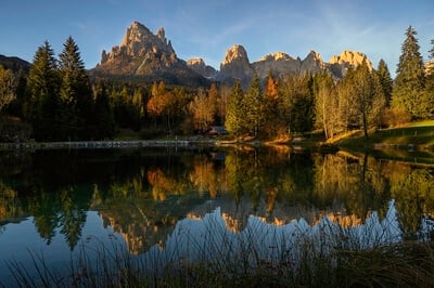 Autumn view of the Pale di San Martino from Lake Welsperg