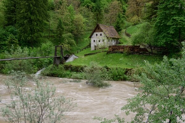 Old Mill on Idrijca River - spring after heavy rains