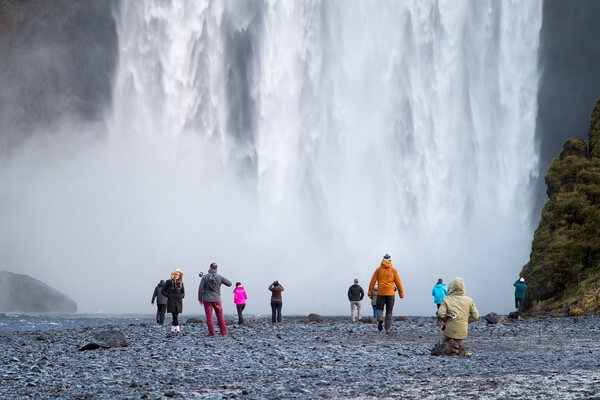 Sometimes it is difficult to get an image without people at the popular sites in Iceland, so one option is to include them.