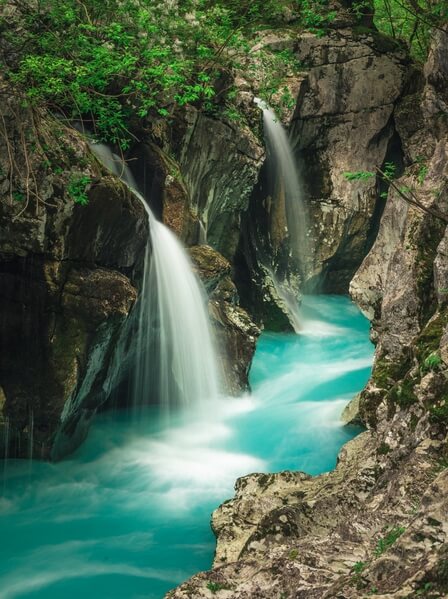 Waterfalls falling into the Soča river
