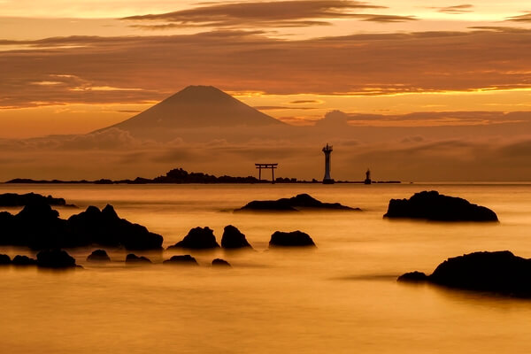 View of Mount Fuji at sunset from Shin-nase Beach in Hayama, Japan.
