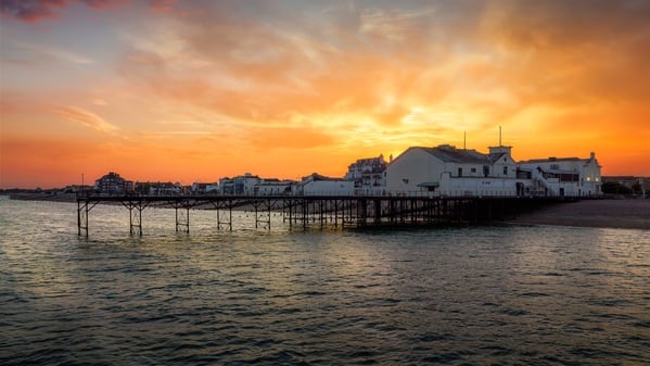 Heavy sunset behind the pier