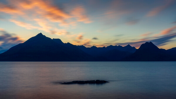 This was taken standing on a high flat rock right out at the water's edge, just after the sun set behind the mountains.