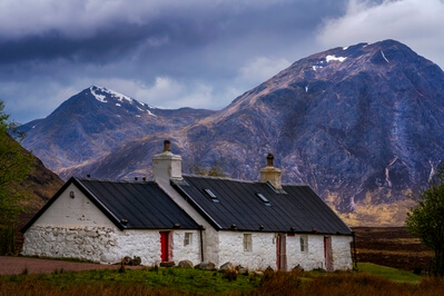 Cross the small road by the cottage and use a long lens to compress the distance between the cottage and Buchaille Etive Mor