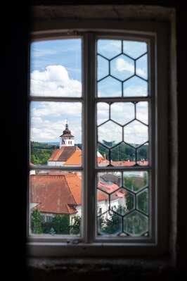 View of the Church of Holy Trinity through the window of the Butter Tower in Nové Město nad Metují