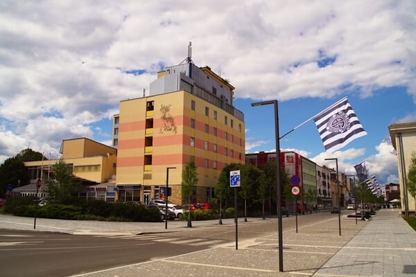 South end of Slovenska street with former hotel Diana and flags of FC Mura fans