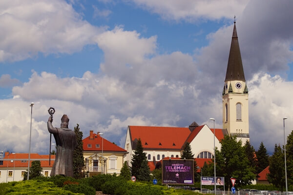 Saint Nicholas church and statue from nearby roundabout.