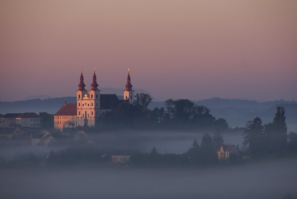 Church and monastery of Sveta Trojica in Slovenske Gorice in autumn morning, view from Zgornje Verjane