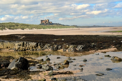 Looking north across the beach to the imposing Bamburgh Castle