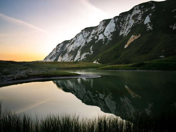 Dusk skies, reflecting with the white cliffs.