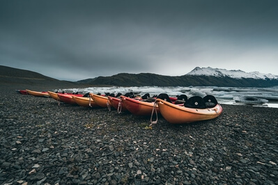 Canoes moored up on the shore.