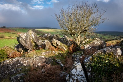 This was taken on one of those typical Dartmoor days where you get different types of weather happening all at the same time!  There were outbreaks of sunshine whilst on the horizon mist and darker clouds were forming.  I had to sit and wait for the sun to break out to get the shot I wanted.