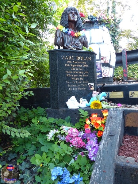Marc Bolan's Rock Shrine, Gipsy Lane, Barnes, SW15 5RG London. Photograph taken on the 16th September 2021 - The 44th Anniversary of his passing at this site. Marc's Shrine has been cared for since 1999 by TAG (T.Rex Action Group) via an in-perpetuity lease on the site. The PRS Memorial was installed in September 1997 for the 20th Anniversary. Five years later the bronze bust of Marc Bolan was installed for the 25th Anniversary. Both were unveiled by Marc Bolan's only heir Rolan Bolan who was just 10 days short of his second birthday when his dad died. That fateful night Rolan was asleep at his paternal grandparents home in Putney. Marc and his partner, Rolan's mother were on their way home at 142 Upper Richmond Road West, Sheen.  