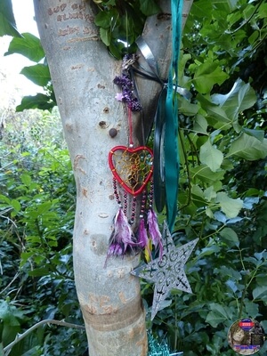 Tributes hanging from another Tree at Marc Bolan's Rock Shrine, Gipsy Lane, Barnes, SW15 5RG London. Photograph taken on the 16th September 2021 - The 44th Anniversary of his passing at this site. 