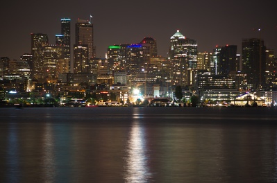 Seattle city lights reflecting off of Lake Union as seen from Gasworks Park.