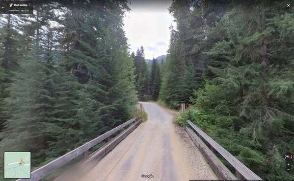 View from the bridge crossing Rainy Creek on FS road 6700 heading NW towards the tree.  This is a screen shot from Google Maps posted by Mark Lambie in 2020.