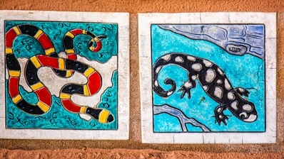 All of the structures are decorated.  The entrance plaza includes dozens of tiles depicting Florida wildlife.  The Coral Snake is extremely venomous but rarely bites dues to a small mouth.  The mnemonic red touches yellow, it's a dangerous fellow is used to differentiate the Coral Snake from the King Snake. 