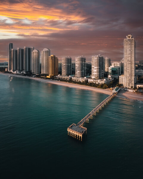 Visit Sunny Isles at sunrise to catch some amazing golden hour colors.