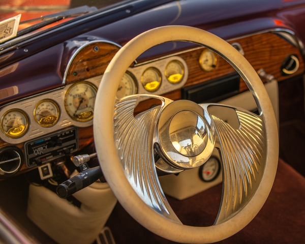 The steering wheel is custom made. The vehicle is a 1930's Ford.