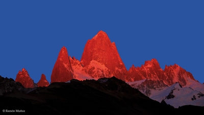 Sunrise over Chalten or Fitz Roy, 3,405 m., Patagonian Andes. Without the sun of sunrise, only with the clarity of dawn the mountains are tinged with an intense red.